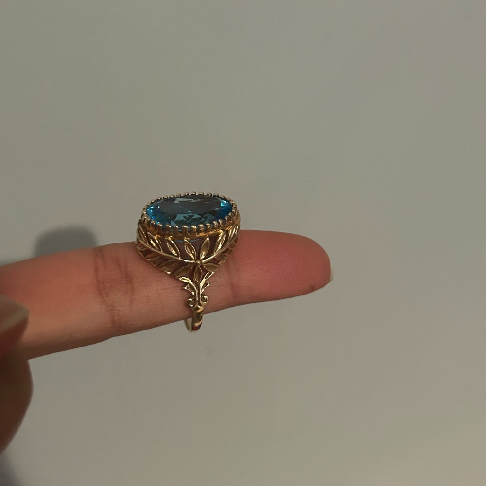14k yellow gold ring with oval blue topaz